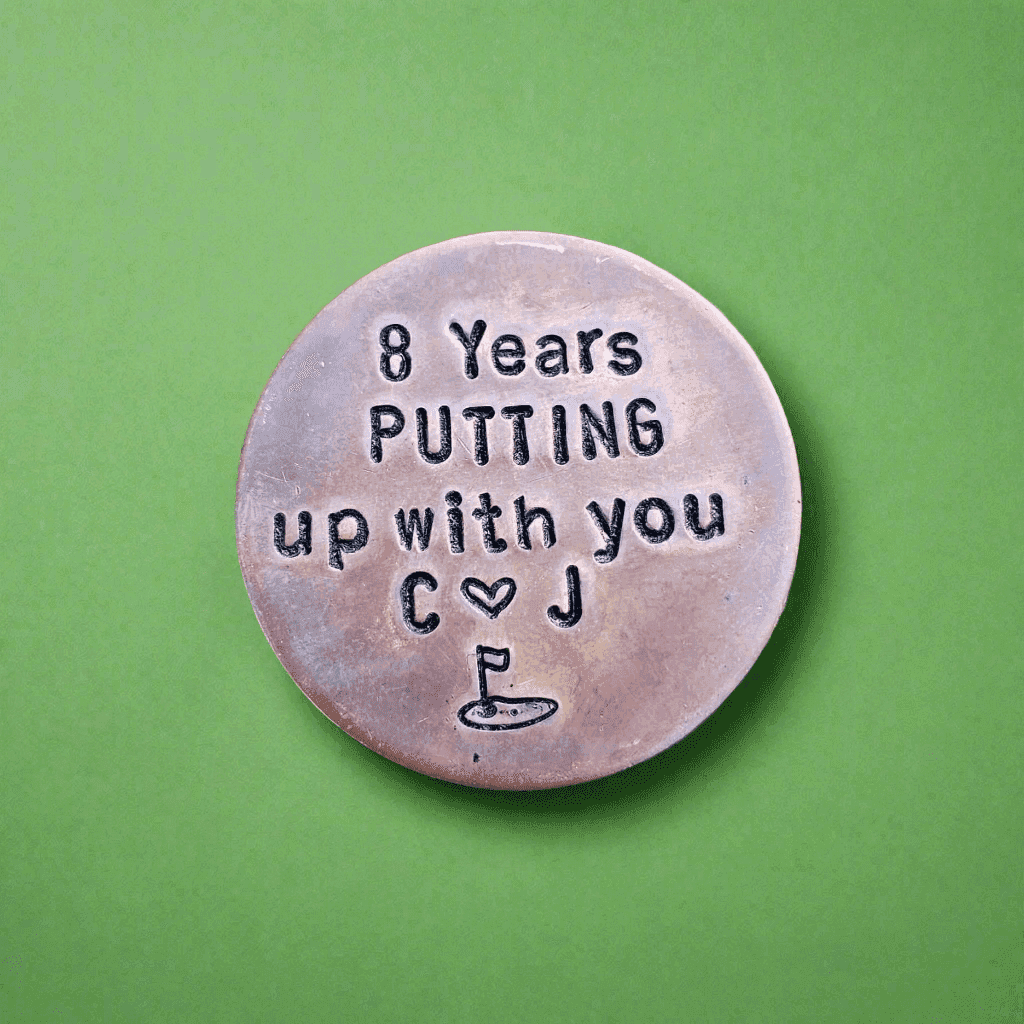 8 Years golf ball marker.
