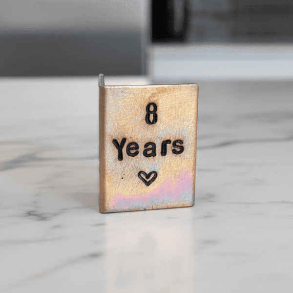 Miniature handcrafted bronze card displaying "8 Years" for 8th Anniversary personalized gifts.
